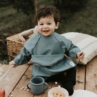 Long-sleeved Bib with integrated pocket 6-24m - Majestic Blue